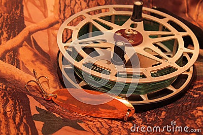 Inertia fishing reel with oscillating lure Stock Photo