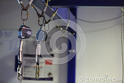 An inertia reel shock absorber lanyard as fall arrest fall restraint system retractable devices Stock Photo