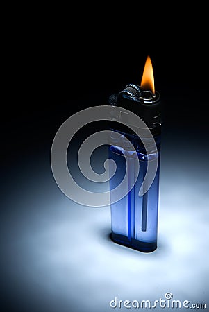 The inexpensive cigarette lighter with flame Stock Photo