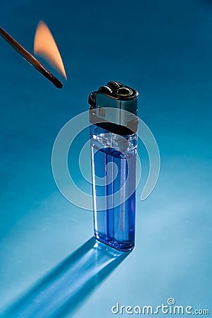 The inexpensive cigarette lighter with match flame Stock Photo