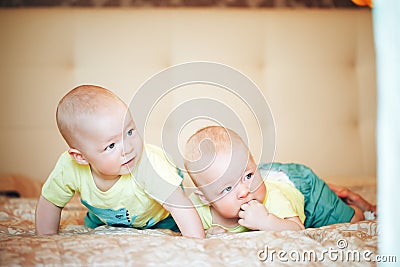 Infant Baby Child Twins Brothers Six Months Old at Home on the Bed Stock Photo