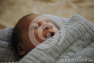 Infant baby fast asleep on the bed Stock Photo