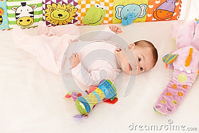 Infant with baby toys Stock Photo