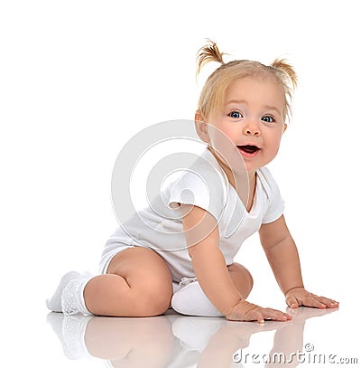 Infant child baby girl toddler crawling happy looking straight Stock Photo