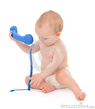 Infant child baby kid toddler playing calling by phone Stock Photo