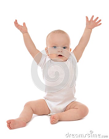 Infant child baby toddler sitting hands up Stock Photo