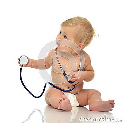 Infant child baby toddler sitting with medical stethoscope for p Stock Photo