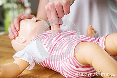 Infant CPR two finger cvompression Stock Photo