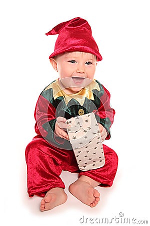 Infant dressed in elfs santas little helper fancy dress costume Stock Photo