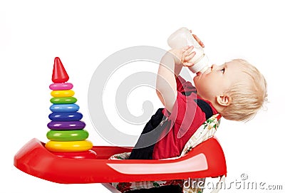 Infant drinking milk Stock Photo