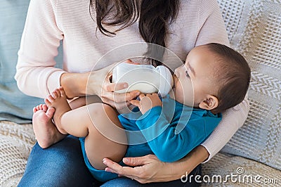 Infant drinking milk Stock Photo