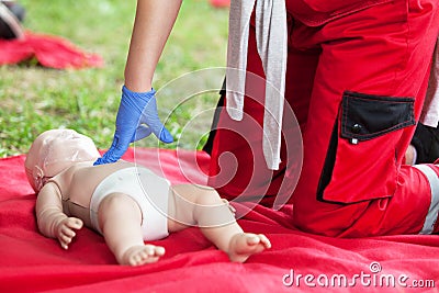 Baby CPR dummy first aid training Stock Photo