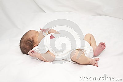 Infant laying on her back Stock Photo