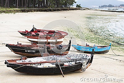 Small fishing boats beached in the sand Editorial Stock Photo