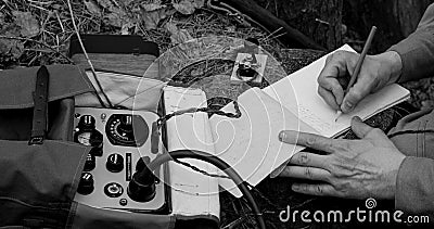 Infantry Army Soldier In World War II using Portable Radio Transceiver In Trench Entrenchment In Forest. . Headphones Stock Photo