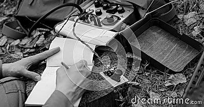 Infantry Army Soldier In World War II using Portable Radio Transceiver In Trench Entrenchment In Forest. . Headphones Stock Photo