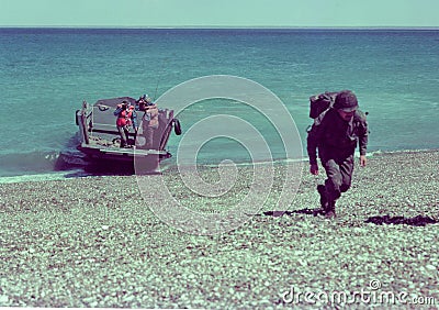 infantry soldiers landed on a beach in the Atlantic Ocean in October 1982, six months before the Malvinas War of April 2, Editorial Stock Photo