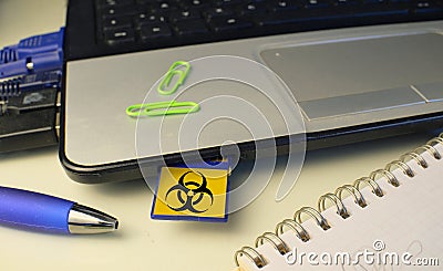 Infecting a laptop with a Computer Virus via a memory card, computer virus attack,hacking,malware,computer crime concept Stock Photo