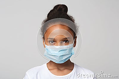 Portrait of little black girl wearing medical mask Stock Photo