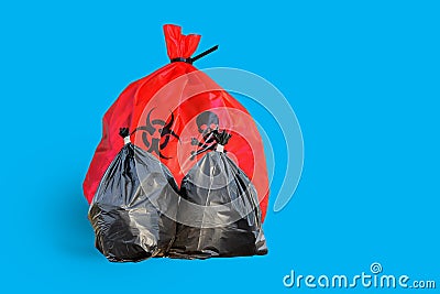 Infectious Wastes In Red Bag On White Background Stock Photo