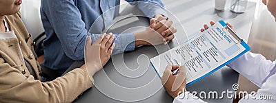 Infertile and medical consultation between young couple and doctor. Neoteric Stock Photo