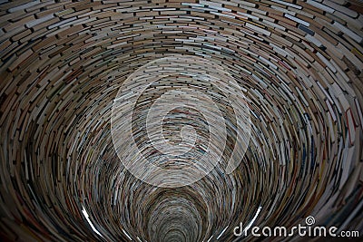 Infinite tunnel of books, also called an endless tower, book tower in the public library of Prague Editorial Stock Photo