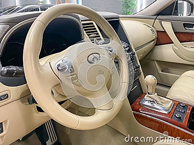 Infiniti FX 37 steering wheel and dashboard. Salon of a new stylish car, steering wheel. Editorial Stock Photo