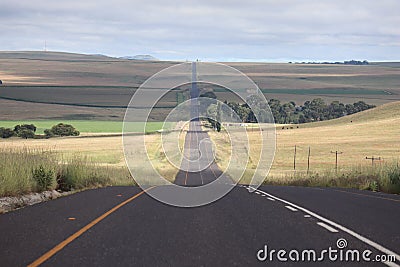 Infinity encapsulated in a straight up and down country road Stock Photo