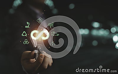 Infinity symbol with Circular business economy environment icons inside lightbulb for future sustainable investment growth and Stock Photo