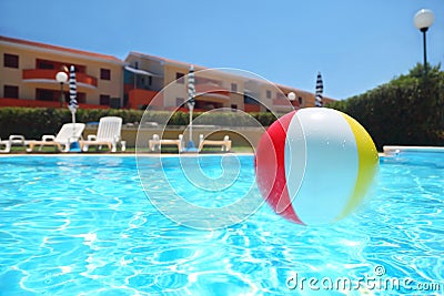 An inflatable ball lies in pool Stock Photo