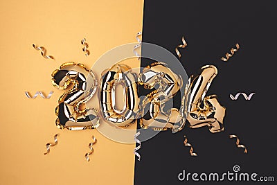 2024 inflatable foil balloons and ribbons confetti. Stock Photo