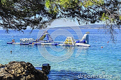 Inflatable slide on the sea. Brela, Croatia. Editorial Stock Photo