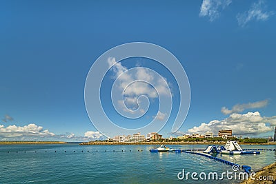 Inflatable slide for water sports, jet ski and motor boating in the Hamakawa fishing port in the vicinity of the American Village Editorial Stock Photo