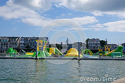 Inflatable water features at a temporary water park on the water Editorial Stock Photo