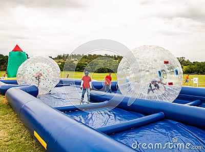 Inflatable water slides and other activities Editorial Stock Photo