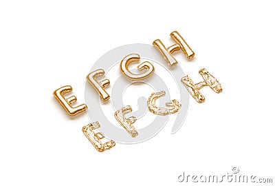 Inflated, deflated gold E F G H letters, balloon font Stock Photo
