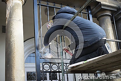 Welder working in St Peters Hill Surgery Entrance. 25 February 2020. Editorial Stock Photo