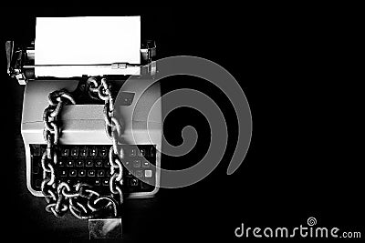 Information censorship - Typewriter locked with a chain Stock Photo