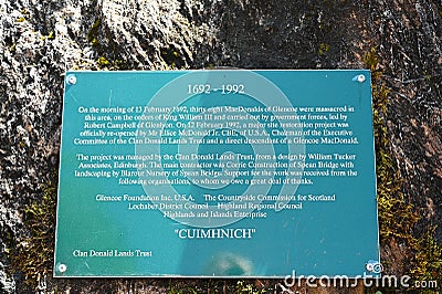 Information commemorative plaque at Glencoe Massacre Memorial monument in Scottish Highlands. Editorial Stock Photo