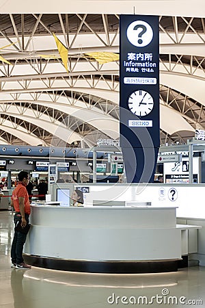 Information counter inside passenger departure terminal, Kansai International Airport, Osaka, Japan Editorial Stock Photo