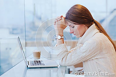 Information overload, stress concept, sad desperate woman with computer Stock Photo
