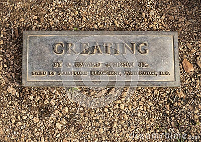 Information plaque for`Creating` by artist Seward Johnson Jr. in Lincoln Square in the City of Arlington, Texas. Editorial Stock Photo