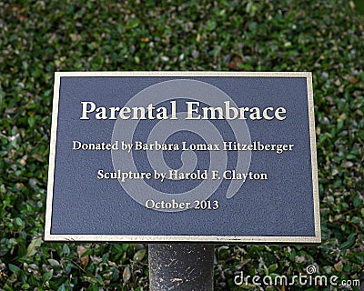 Information plaque for `Parental Embrace` by stone carver Harold F. Clayton in Hitzelberger Park, Dallas, Texas Editorial Stock Photo