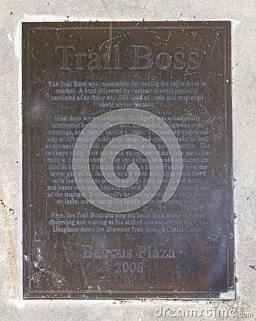 Information plaque for a sculpture of a trail boss cowboy sitting on a horse by Robert Summers in Plano, Texas. Editorial Stock Photo