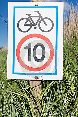 Information signboard about bicycle speed limitation Stock Photo