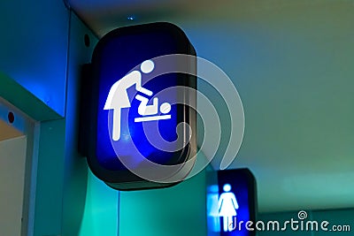 Information signs at the entrance to the toilet. Changing room Stock Photo