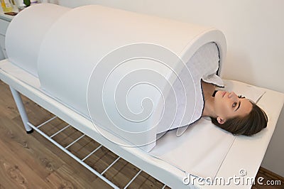 Infrared heat tunnel for slimming body Stock Photo