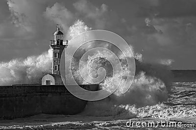 Infrared stormy waves over old lighthouse Stock Photo