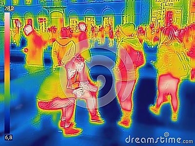 Infrared Thermal image of people at the city railway station on a cold winter day Stock Photo