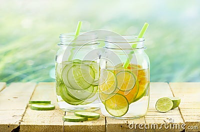 Infused detox water, Vintage and pastel color tone, Detox diet lemon and cucumber on wooden nature background Stock Photo